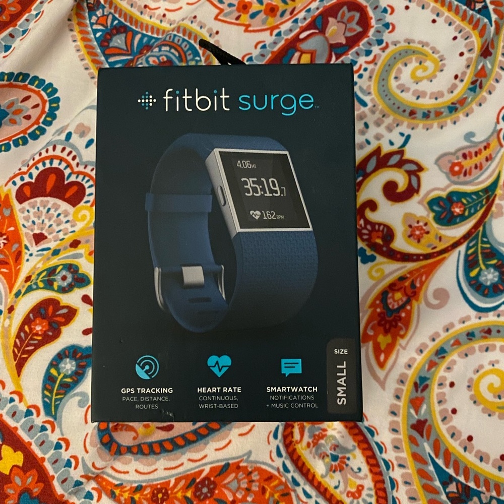 Women’s blue Fitbit surge watch